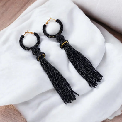 Elegant Black Beaded Hoop Earrings with Tassel Detail