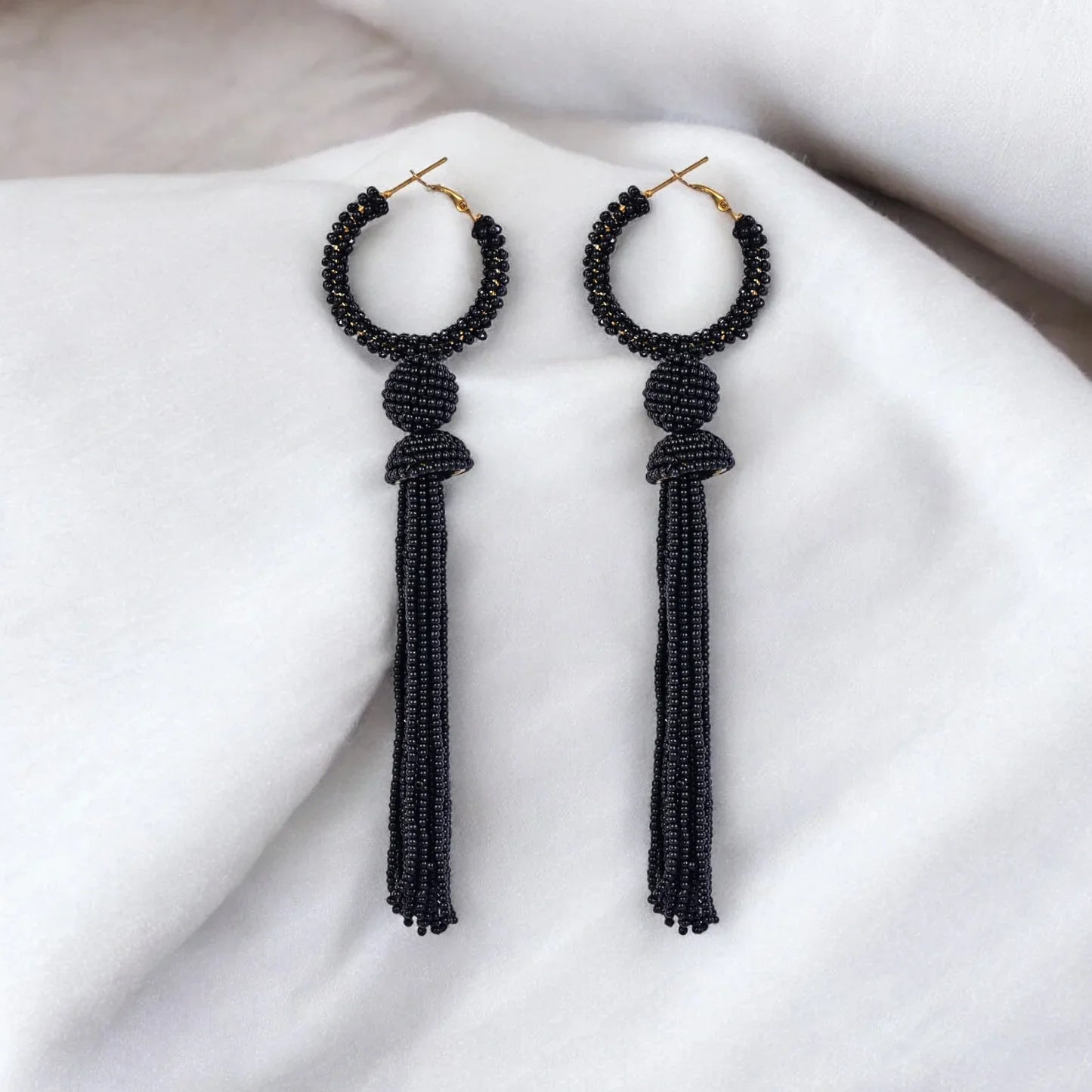 Elegant Black Beaded Hoop Earrings with Tassel Detail